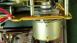 Motor with brass replica rear cover installed in the deck